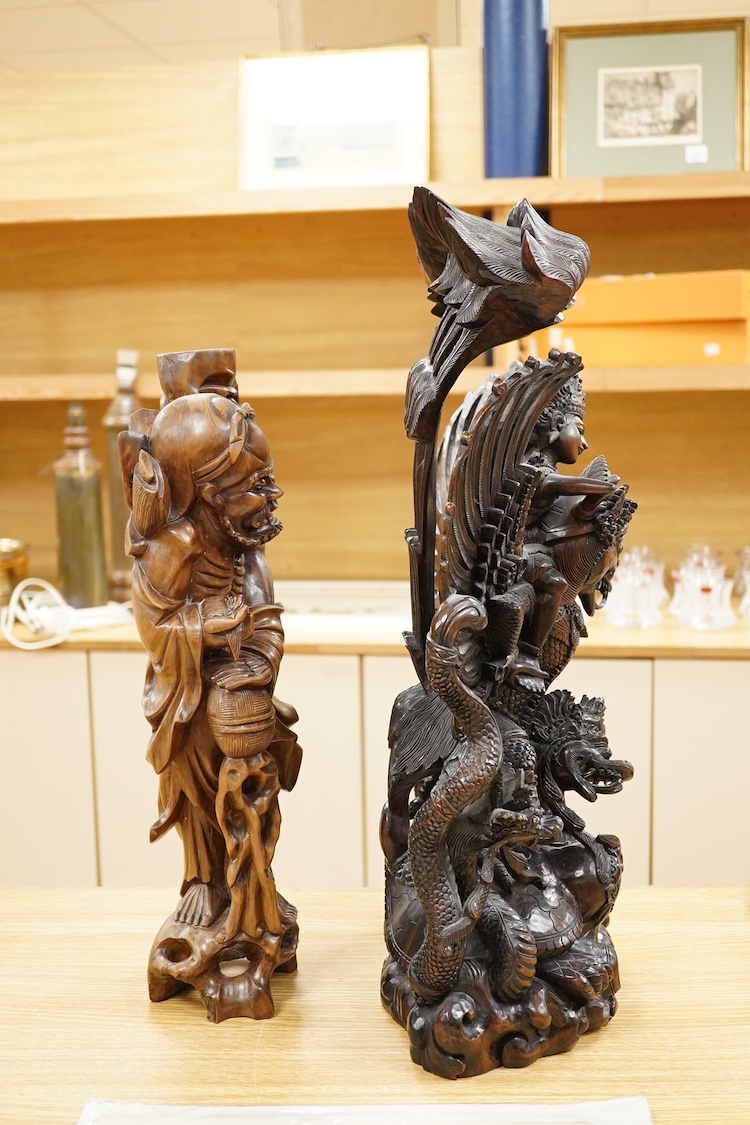 A large Indonesian hardwood Garuda group and a Chinese hardwood figure of a Luohan, largest 61cm high